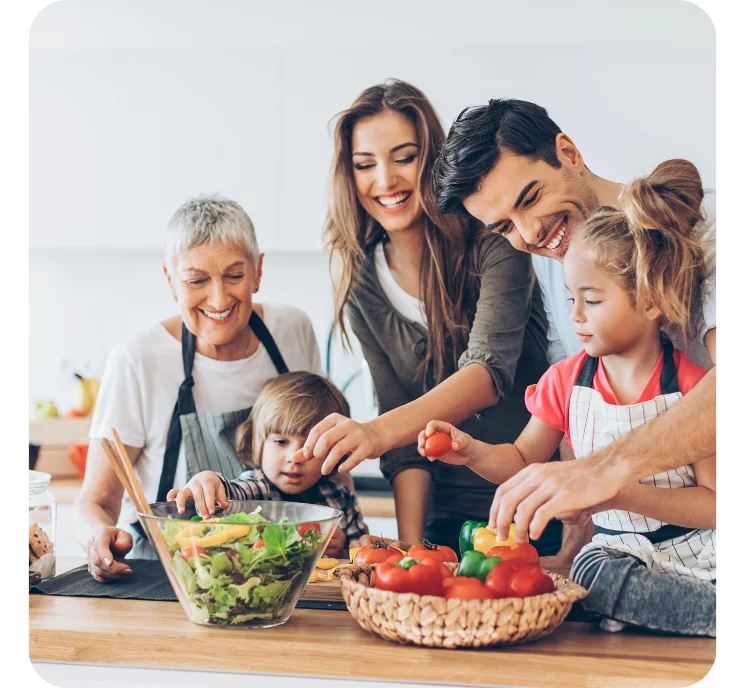 Picture of a happy family preparing a meal. 